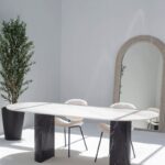 Dakota Greek Calacatta Marble Oval Dining Table With Black Marquina Half Moon Legs