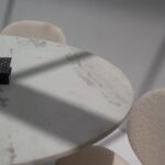 Aloise White Marble Top Round Dining Table with Black Base