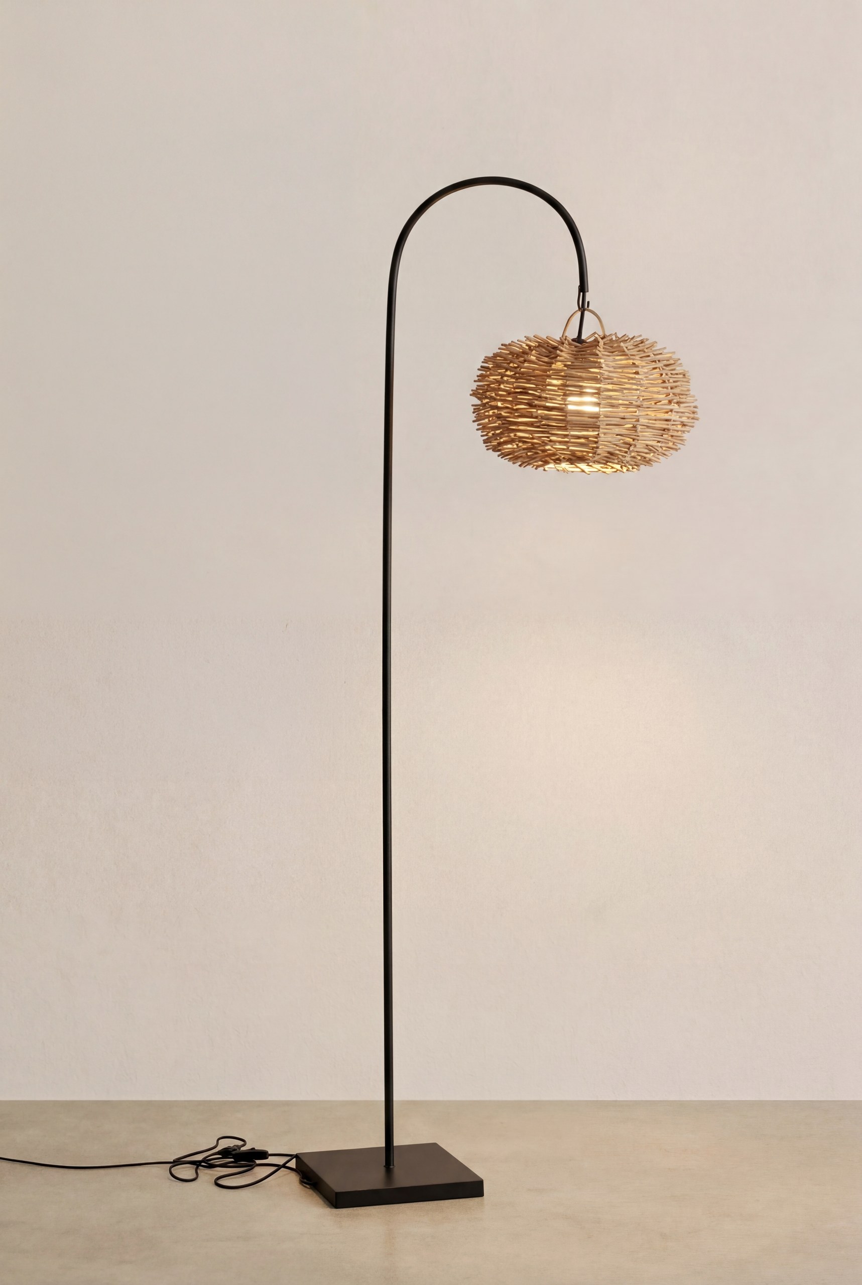 Melqa Natural Rattan Globe Floor Lamp with Arched Metal Stand